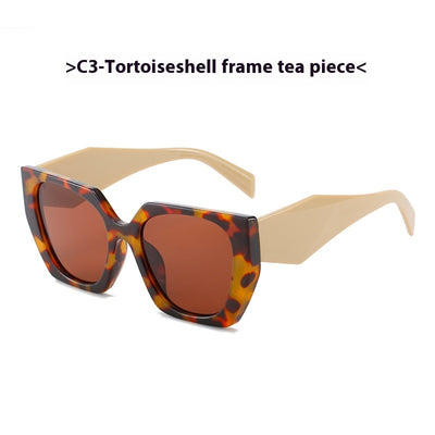 Retro cat-eye sunglasses with a vibrant orange frame, brown temples, and light champagne-colored lenses. - Image 7