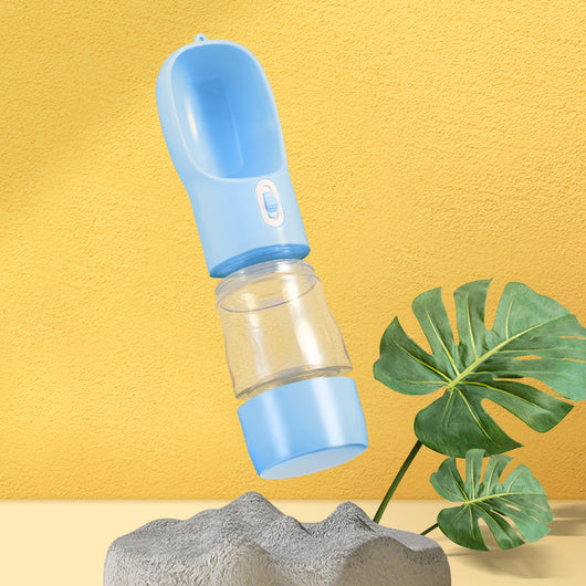 Pink portable pet water bottle with integrated feeder bowl, clear reservoir, and dispensing button for dogs. - Image 31
