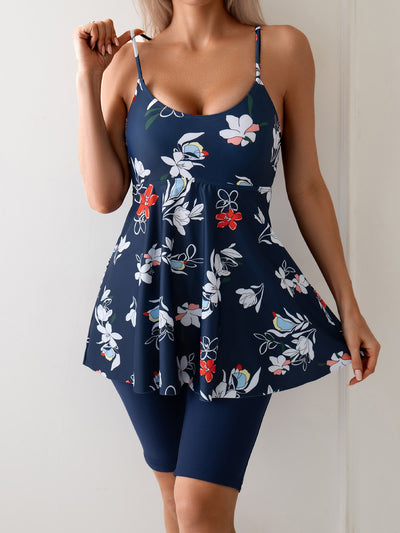 Women's navy blue two-piece swimsuit with white floral tankini top and matching solid swim shorts. - Image 26