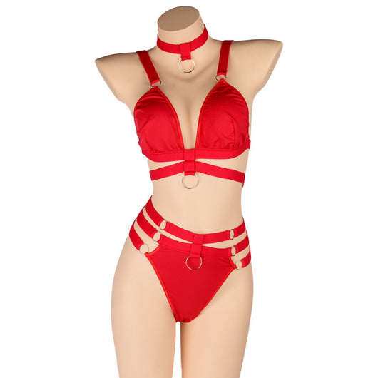 Woman wearing a royal blue strappy lingerie set with O-rings, including a bra, high-waisted bottoms, and a choker. - Image 6