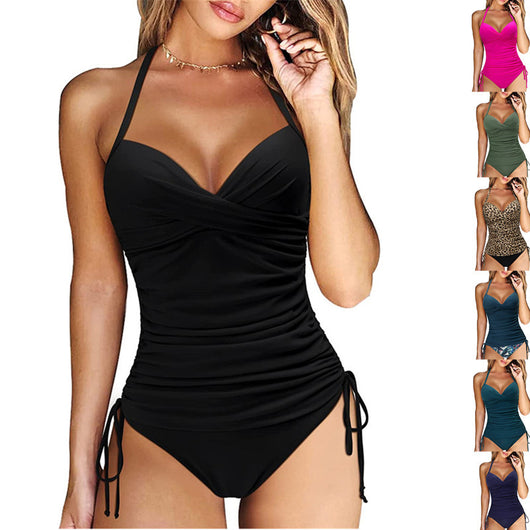 Black women's tankini swimwear set with criss-cross straps, ruched sides, and high-waisted bikini bottoms. - Image 2