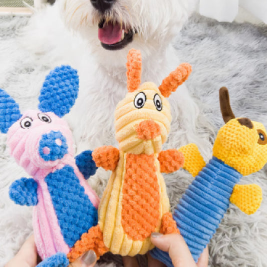 Plush rabbit pet toy with a beige ribbed body and orange textured ears, nose, belly, and feet, featuring a squeaker.