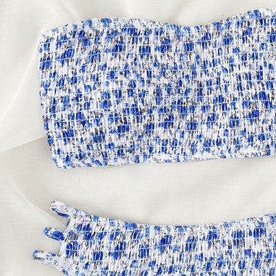 Floral smocked strapless bandeau bikini with high-cut bottoms featuring side straps, in white, teal, and red. - Image 4