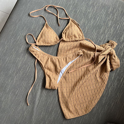 White textured bikini with ruched triangle top, high-cut bottom, and matching sarong with a large bow. - Image 20