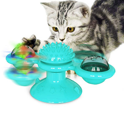 Green windmill cat toy with suction cup base, spinning arms, textured ball, and colorful lights, being played with by a tabby cat. - Image 12