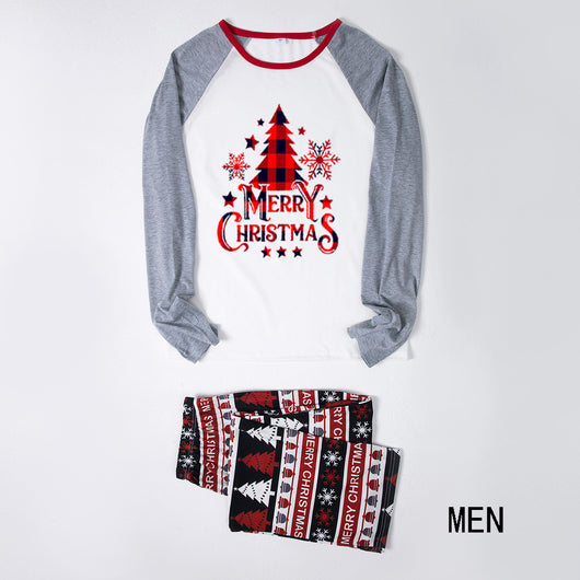 Family of four wearing matching Christmas pajamas with 'MERRY Christmas' text, leopard print, and plaid trees. - Image 20
