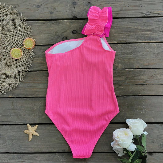 Black one-shoulder ribbed one-piece swimsuit with a ruffled blue and black strap, ideal for women's swimwear. - Image 15