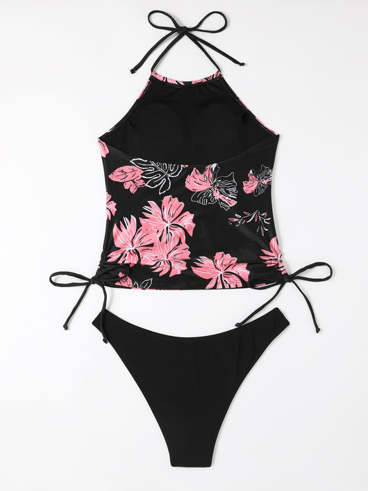 Black halter-neck tankini swimsuit with pink and white floral print, paired with solid black high-cut bikini bottoms. - Image 9