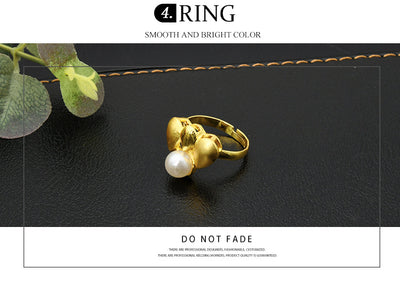 Women's four-piece jewelry set with matte gold teardrop links and white pearls, including a necklace, earrings, ring, and bracelet. - Image 11