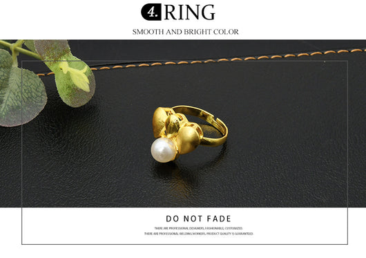 Women's four-piece jewelry set with matte gold teardrop links and white pearls, including a necklace, earrings, ring, and bracelet. - Image 11