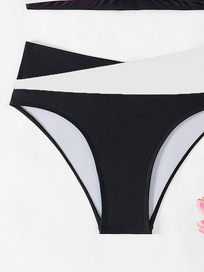 Black and white color-block halter bikini with high-waisted bottoms, modeled by a woman holding a straw hat. - Image 25