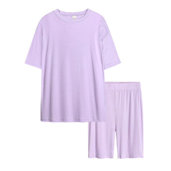 Light pink ribbed knit short-sleeved t-shirt and biker shorts two-piece loungewear set for women.