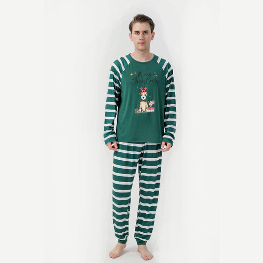 Woman in a Christmas pajama set with a white top, green sleeves, dinosaur graphic, and green fair isle pants. - Image 6