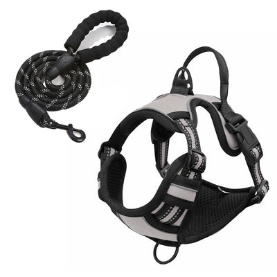 Red and black dog harness with reflective strips, adjustable straps, and a top handle for secure pet control. - Image 23
