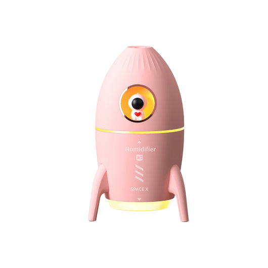Pink rocket-shaped humidifier with an astronaut figurine in a circular window and a glowing yellow light band. - Image 7