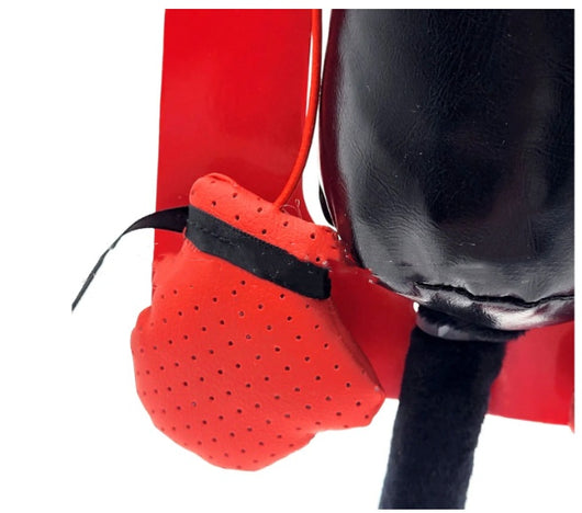 Cat teaser toy with a black elastic cord, mesh bag, and a small red boxing glove, held by a hand showing its suction cup base. - Image 6