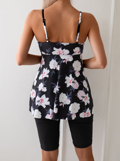 Women's navy blue two-piece swimsuit with white floral tankini top and matching solid swim shorts. - Image 13