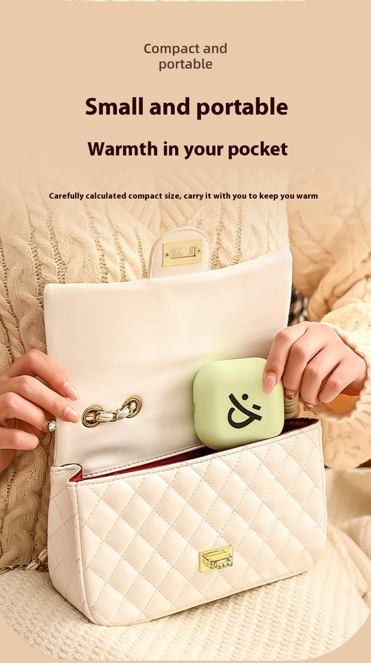 Light green square hand warmer with rounded corners and a black smiley face, hanging from a two-tone lanyard. - Image 10