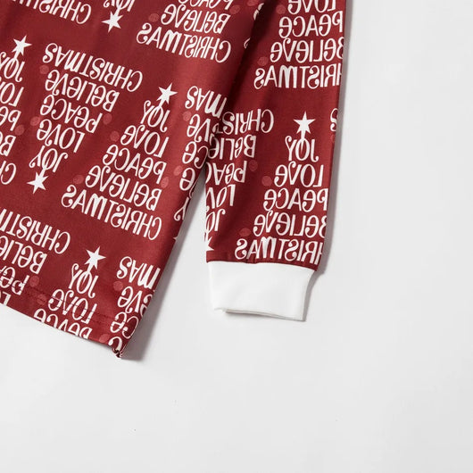 Family of four in matching Christmas pajamas: white tops with red tree graphic, red bottoms with white text. - Image 18