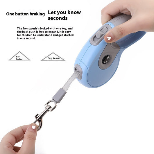 Blue and grey retractable dog leash with a black waste bag dispenser and a silver metal clip. - Image 2