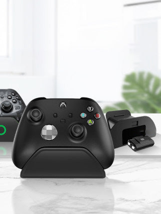 Black AOLION universal gamepad stand made of ABS plastic, designed to hold a game controller upright. - Image 3