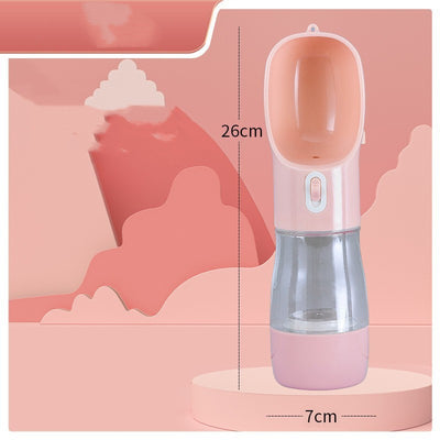 Pink portable pet water bottle with integrated feeder bowl, clear reservoir, and dispensing button for dogs. - Image 12