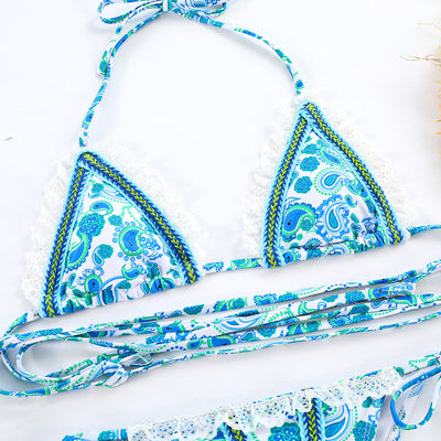 Women's blue and green paisley print bikini with white lace trim, triangle halter top, and tie-side bottoms. - Image 12
