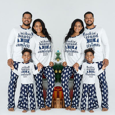 Family of three wearing matching white and navy blue Christmas pajamas with "Rockin' around THE Christmas TREE" text. - Image 12
