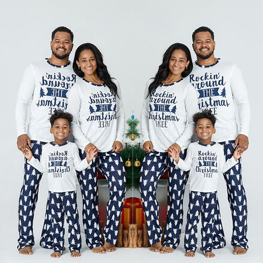 Family of three wearing matching white and navy blue Christmas pajamas with "Rockin' around THE Christmas TREE" text. - Image 12