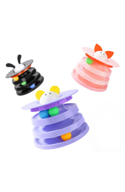 Brown tabby cat sniffing a black and orange multi-level rotating cat plate toy with colorful balls and bunny ears. - Image 10