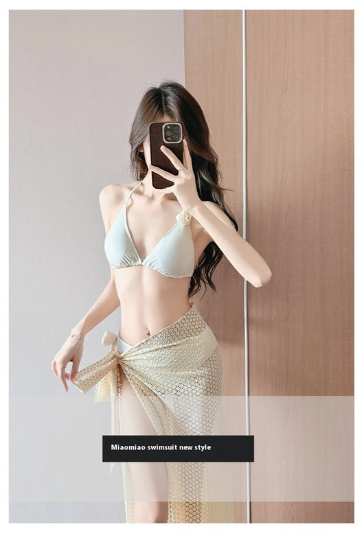 Women's light purple three-piece bikini set with a triangle halter top, bottoms, and a mesh sarong with rose details. - Image 15