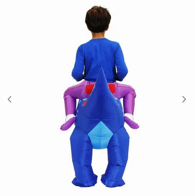 Young boy in an inflatable blue dinosaur costume with a yellow cap and pink goggles, next to a fan and battery pack. - Image 2