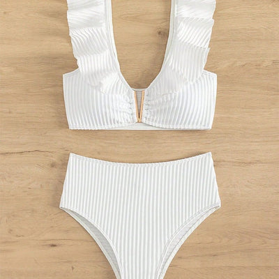 White ribbed bikini with ruffled shoulder straps and high-waisted bottoms on a model at a tropical beach. - Image 4