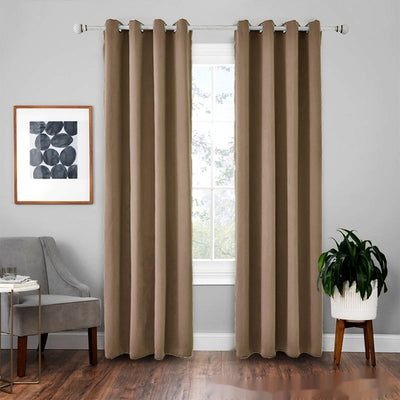 Light gray polyester blackout curtains with grommet tops hanging on a white rod in a modern living room. - Image 17