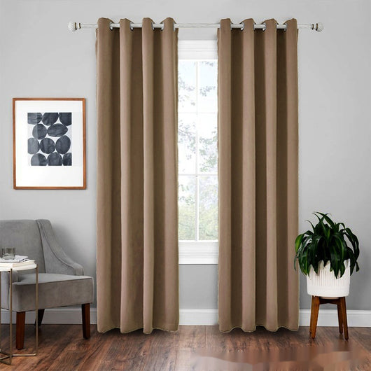 Light gray polyester blackout curtains with grommet tops hanging on a white rod in a modern living room. - Image 17