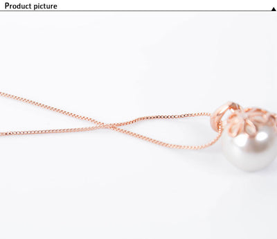 Rose gold-toned necklace and drop earrings set with white spherical pearls and clear rhinestone accents. - Image 7