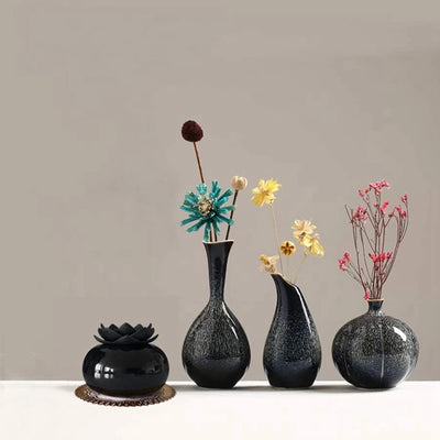 Black spherical aromatherapy humidifier with a lotus flower top, emitting mist, sitting on a gold decorative doily. - Image 7