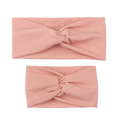 Matching dusty rose ribbed knit headbands with a twisted knot, one for an adult and one for a child. - Image 10