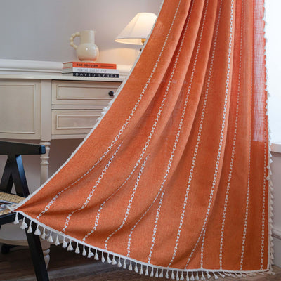 Black polyester curtain with white jacquard multi-line pattern and black tassels, draped over a white chair. - Image 23