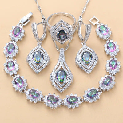 4-piece women's jewelry set with silver-tone necklace, ring, earrings, and bracelet, featuring red oval gemstones surrounded by clear accent stones. - Image 2
