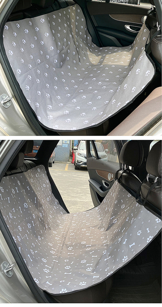 Pink car pet mat with white paw print and bone patterns, featuring black straps for securing to a rear seat. - Image 35