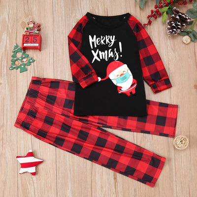 Family matching Christmas pajamas with black tops, red plaid sleeves, and Santa wearing a mask, paired with red plaid pants. - Image 7