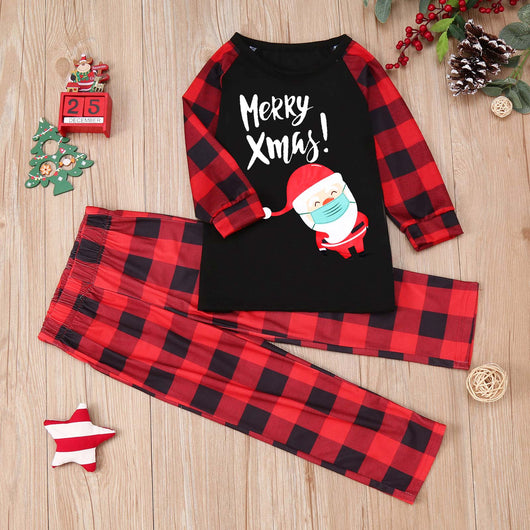 Family matching Christmas pajamas with black tops, red plaid sleeves, and Santa wearing a mask, paired with red plaid pants. - Image 7