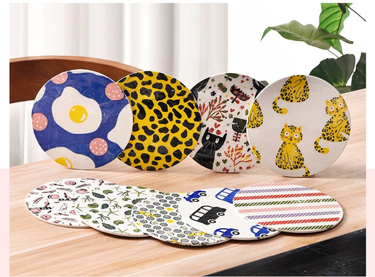Ceramic plate with yellow cartoon leopard cat underglaze decals and a sheet of the same decals. - Image 3