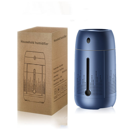 White cylindrical household humidifier with a visible water level indicator, next to its brown cardboard packaging. - Image 8