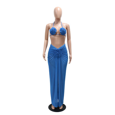Blue three-piece bikini set with floral appliques on the triangle top, thong bottom, and matching ruched maxi skirt. - Image 36