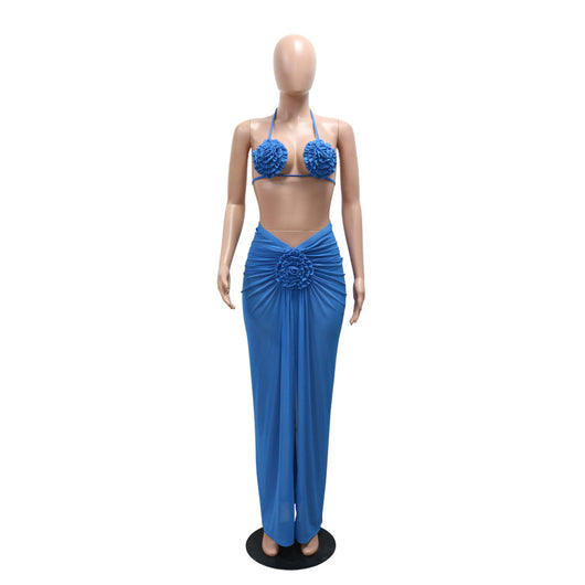Blue three-piece bikini set with floral appliques on the triangle top, thong bottom, and matching ruched maxi skirt. - Image 36