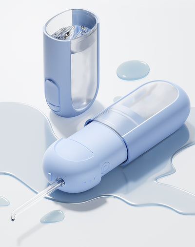 White portable electric dental water flosser with a clear nozzle and retractable water tank for oral hygiene. - Image 33