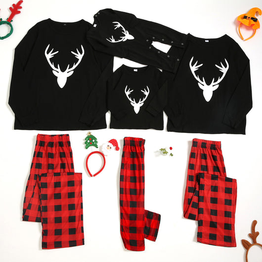 Family matching Christmas pajamas: black long-sleeve tops with white deer prints and red buffalo plaid pants. - Image 12