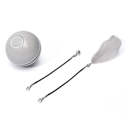 White and black self-rotating cat toy with an orange ball on a flexible rod, showing motion blur. - Image 19